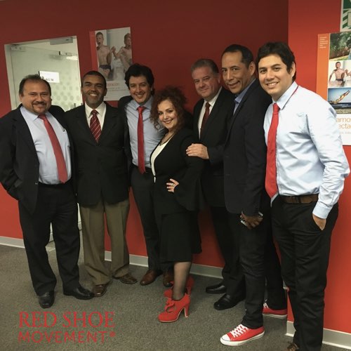 At an in-house leadership training for Novartis Andean Region, men show up in red ties, socks and shoes to openly show support for women's career growth.