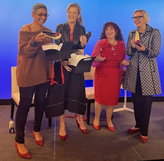 Susan Podlogar (Right) EVP, Chief HR Officer, MetLife, Samantha Skey, CEO, SHE Media and Zainab Salbi, Co-Founder Daughters for Earth unbox their chocolate shoes created by Cacao by Cipriani